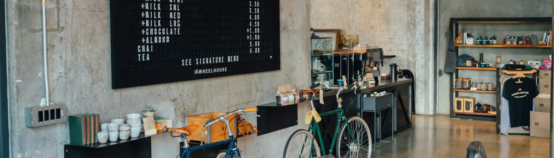 two bikes parked beside wall inside room