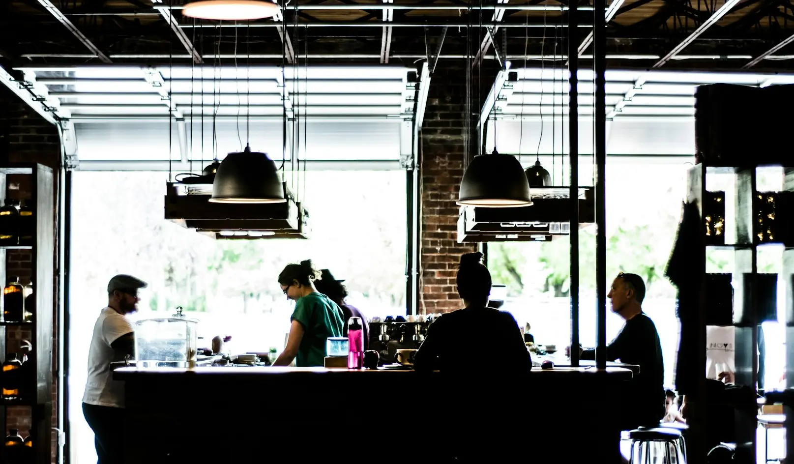 people standing and standing near counter at daytime